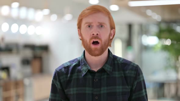 Portrait of Disappointed Beard Redhead Man Reacting to Loss alt