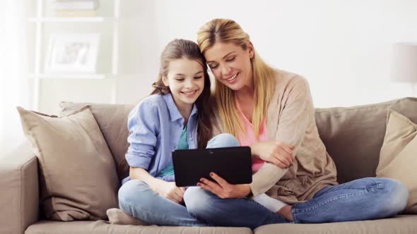 Family Having Video Chat on Tablet Pc at Home alt