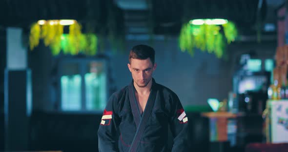 Judo Fighter Looks at the Enemy Before the Fight, a Serious Menacing Look. Portrait View. alt