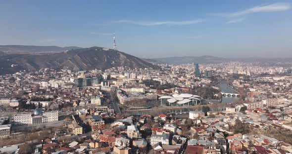 Aerial view of center of Tbilisi under Mtatsminda mountain, Georgia 2022 winter alt