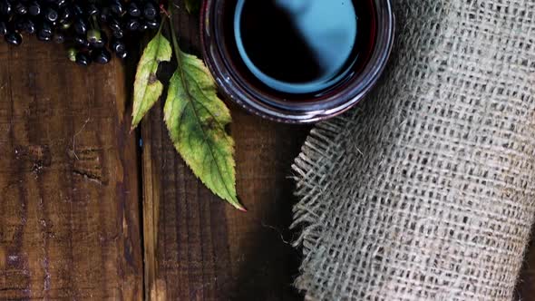 Black Elderberry On Vintage Bags, Elderberry Juice. Black Berry With Squeezed Juice.