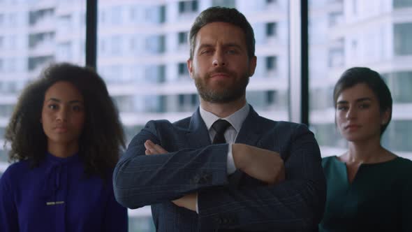 Mixed Race Business Team Posing Looking Camera Confident in Glass Office alt