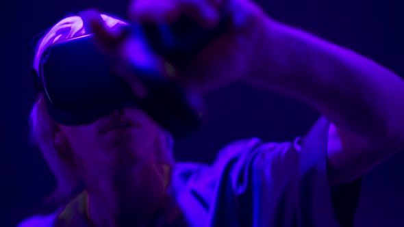 Serious Man VR Glasses Using Controllers in Videogame Closeup alt