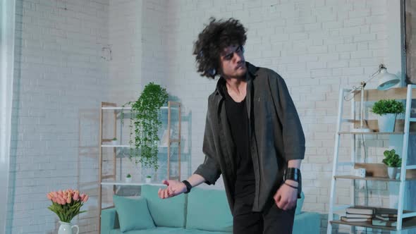 Guy Listening to Music Dancing  Singing and Playing Air Guitar Happy and Crazy alt