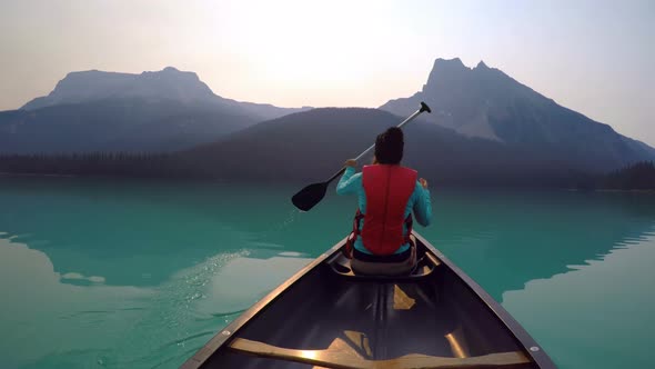 Man travelling on boat in lake alt
