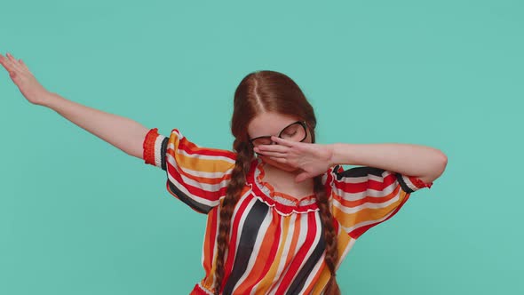Trendy Cheerful Redhead Girl Dancing and Moving Dabbing Raising Hands Making Dubdance Gesture alt