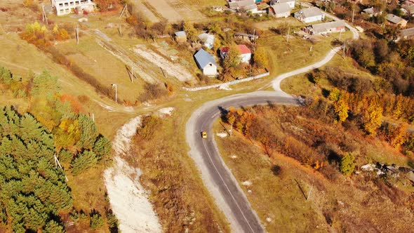 Aerial view of autumn road car