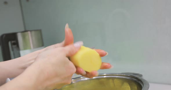 Cleaning Potatoes with a Knife