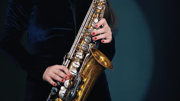 Woman Plays on Saxophone. Musical Concept