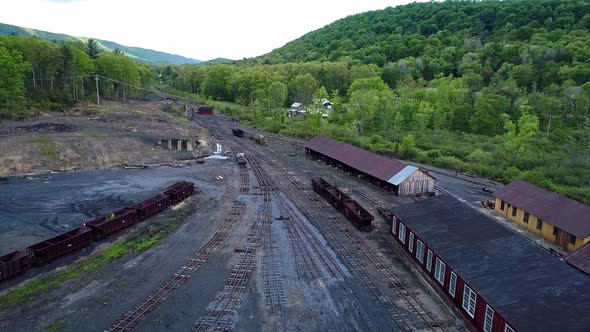 Aerial View of an Abandoned Narrow Gauge Coal Rail Road with Rusting Hoppers alt