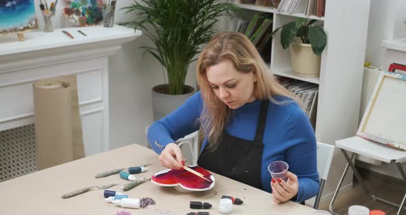 Woman Crafting Big Heart From Epoxy Resin for Valentine's Day