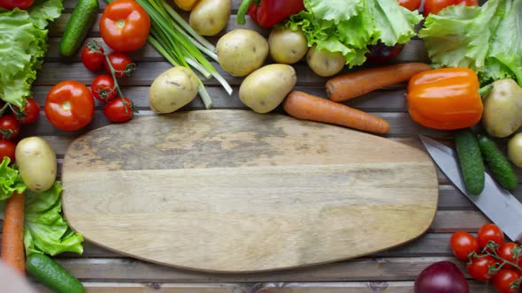 Chef Hands Throwing Spring Onion on Cutting Board alt