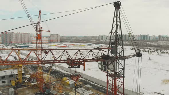 Large Orange Construiction Crane on Unfinished Building alt