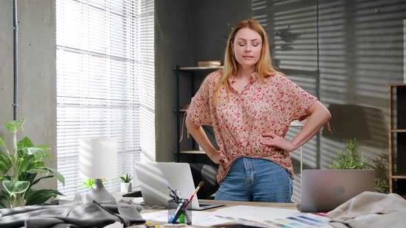 Caucasian Tailor Working at Her Office Looking at Camera and Positively Smiling Small Business alt