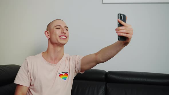 Content Proud LGBTQ Member Streaming with His Phone and Talking to His Online Followers alt