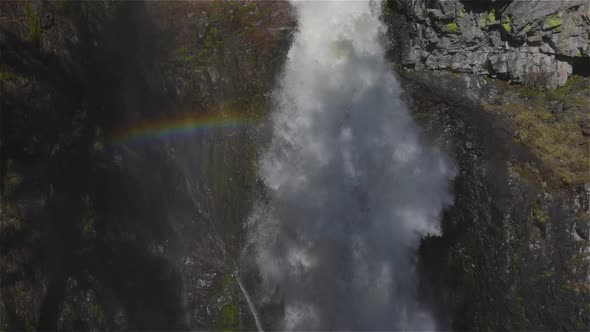 Waterfall Rushing Down a Rocky Canyon in the Canadian Mountains alt