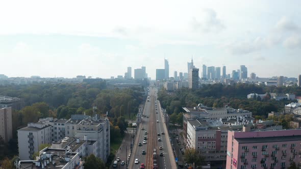 Descending Footage of Vehicles Driving on Wide Straight Street in Town alt