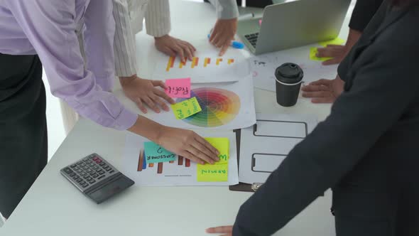 Business People Proficiently Discuss Work Project on Meeting Table alt