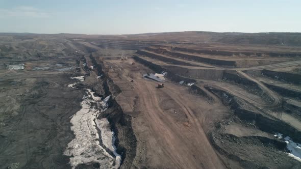 Drone Flight Over Multitiered Road  Serpentine in to Deep Quarry for Extraction of Coal
