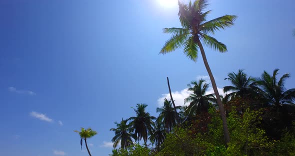 Wide overhead copy space shot of a sandy white paradise beach and turquoise sea background in colour alt