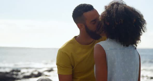 Couple kissing each other at beach 4k alt