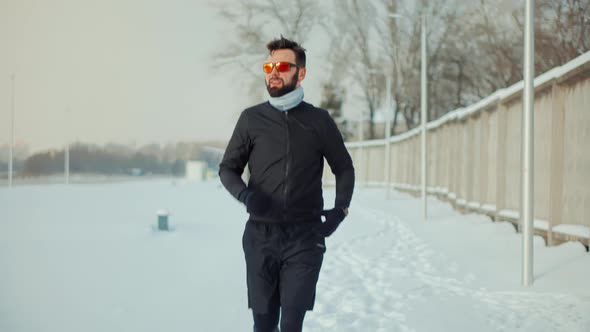 Athlete Jogging In Snow Preparing Triathlon. Sport Healthy Lifestyle Winter. Sportsman Jog Cardio. alt