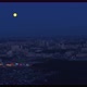 Aerial view of the huge moon above the night city. - VideoHive Item for Sale