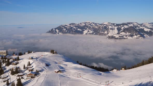 ski area in the Swiss alps with people and chairlifts in the winter ski area of ​​Beckenried alt