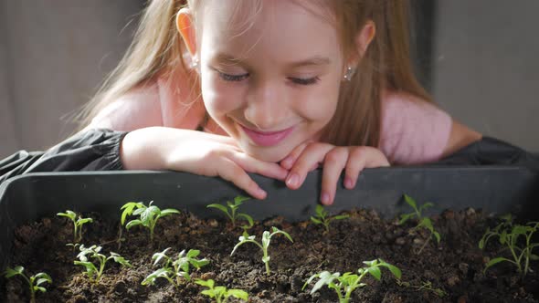Fun Little Gardener Care for Plants. Cute Little Child Girl Planting Seedlings alt