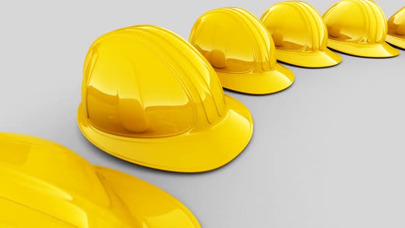 Seamless animation of the circular array of yellow safety helmets. Loopable. HD alt