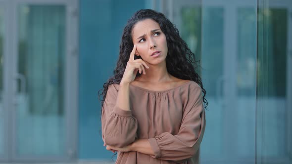 Thinking Hispanic Pensive Girl Woman Deep in Thoughts Thinking About Plan Female Pondering Face alt