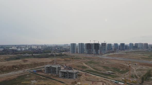 Flight Over The Construction Site. Houses Under Construction alt
