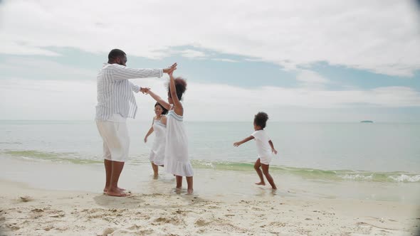 Beach vacation, family, lifestyle, travel, relationship concept. African American family on beach