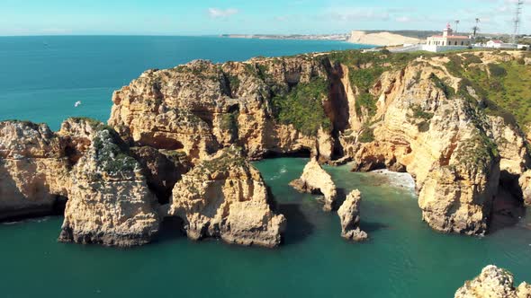 Ponta da Piedade Lighthouse atop cliff in Lagos, Algarve, Portugal alt