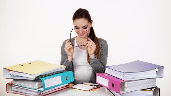 Woman at Desk in Office, Stretching 