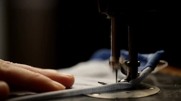 Close Up Of Fabric Sewn On Sewing Machine