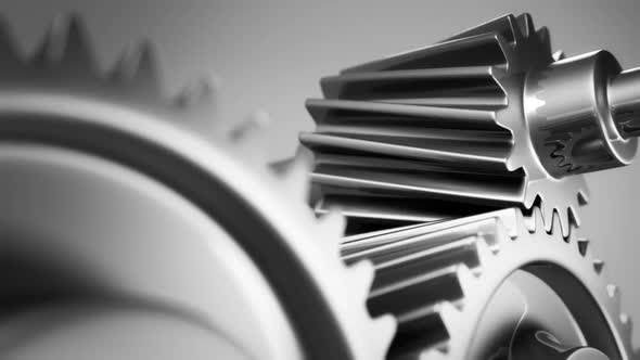 The motion of silver gears working together in endless rotation. Loopable. HD alt