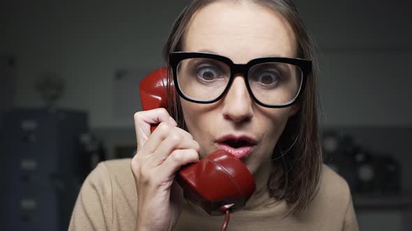 Woman receiving shocking news on the phone