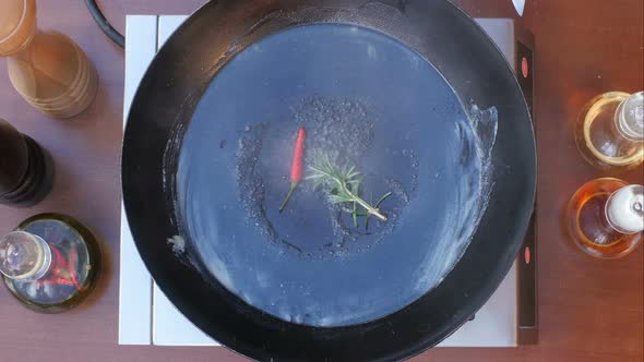 Putting Fresh Seafood in Frying Pan alt