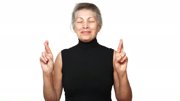 Senior Caucasian Woman Standing with Closed Eyes Thinking About Something Pleasant Making Wish with alt