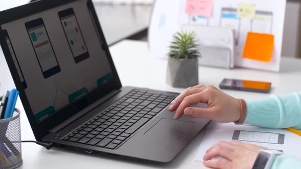 Designer with User Interface on Laptop at Office 17 alt