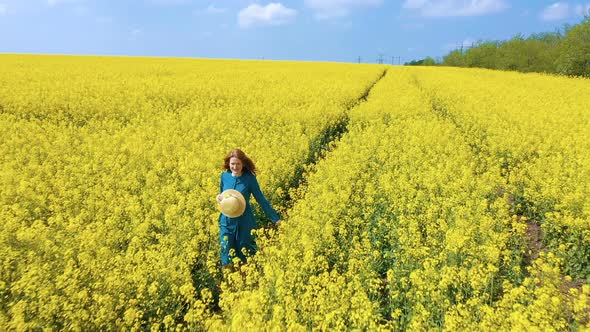 Happy Girl Enjoying At The Rapeseed Field 5 alt