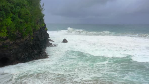 Aerial Footage Over Peaceful Seascape of Pacific Ocean Surf at the Rocky Hawaiian Coastline alt