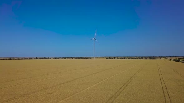 Aerial View of Windmill Rotating By the Force of the Wind and Generating Renewable Energy.  alt