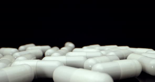 White tablets super macro close up fly over alt