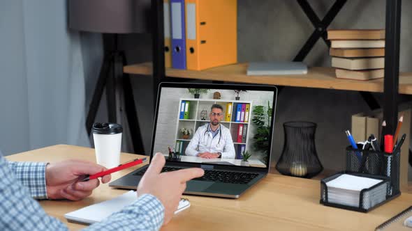 Patient at Home Tells Distance Doctor Online Video Call Webcam Chat Laptop alt