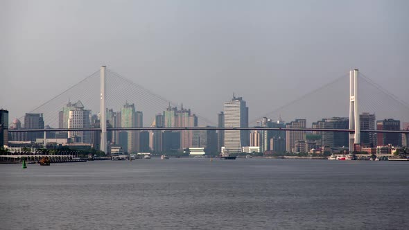 Shanghai Nanpu Bridge Over Huangpu Against City Timelapse alt