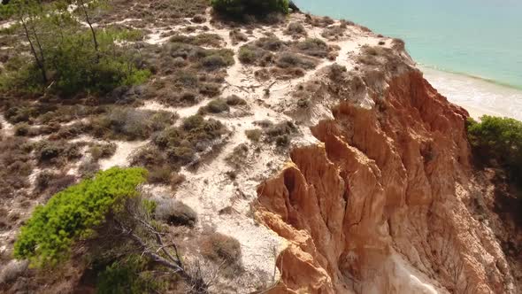 Aerial footage of Falesia Beach (Praia da Falesia) in Algarve, Portugal alt