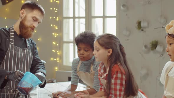 Chef Teaching Kids during Cooking Class alt