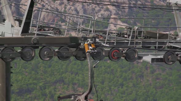 Mechanism of Cable-way with Cabin Moving Past Metal Support